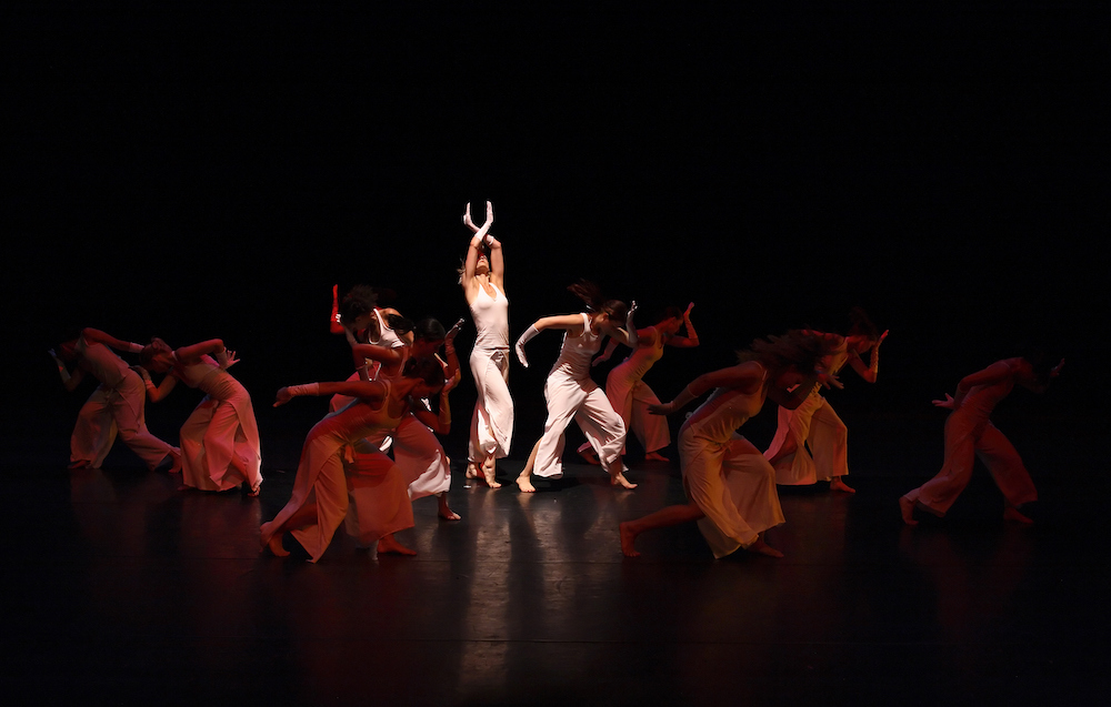 Group of contemporary dancers performing on stage
